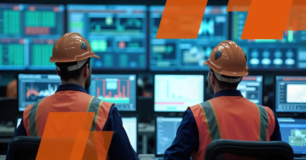 Työntekijät tarkkailevat valvomossa montaa näyttöä